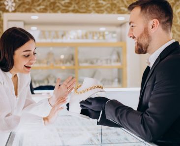 Woman choosing a necklace at jewelry store