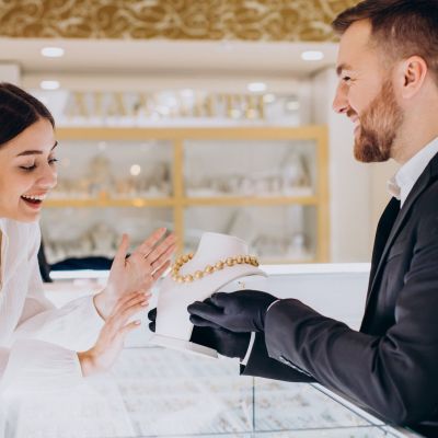 Woman choosing a necklace at jewelry store